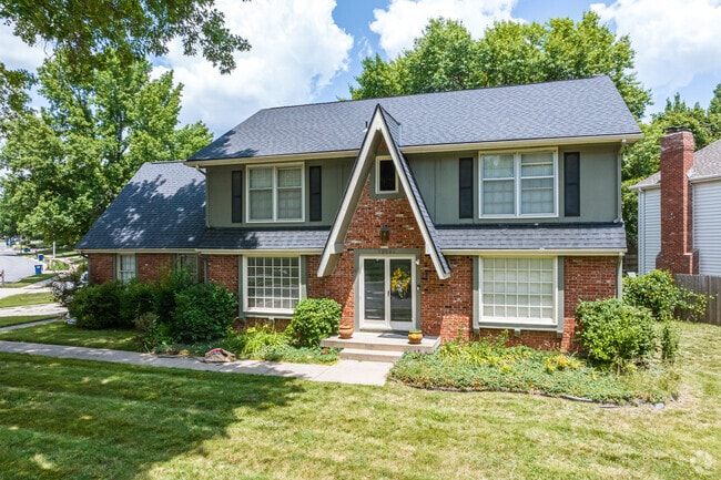Large mature trees shade the homes in the Oak Park neighborhood.