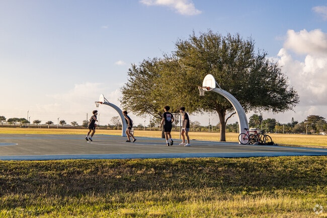 Play a round of basketball at Chuck Pezoldt Park in Richmond West, FL.