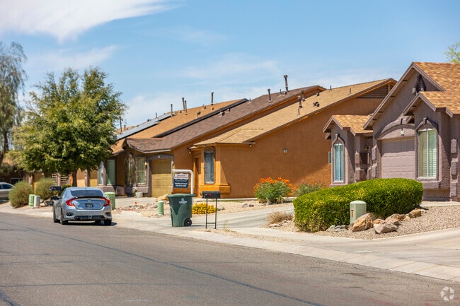 In Tres Pueblos, Spanish-style homes showcase stucco exteriors and red-tiled roofs, reflecting the rich architectural heritage of the Southwest.