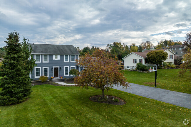 Greek Revival influenced cross-gabled homes offer eclectic charm in Split Rock.