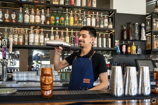 Enjoy handcrafted cocktails and a lively atmosphere at the bar at T'Zunun.