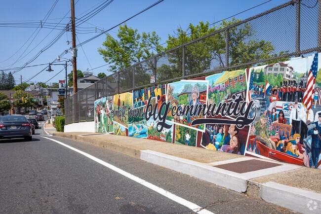 A mural on Mt Airy Street reads 'small town, big community', in Bernardsville, NJ.