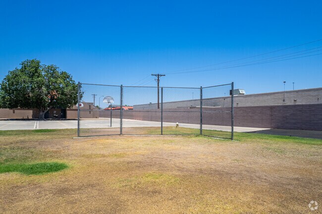 Young athletes practice in the batting cage at Washington Elementary in Phoenix.