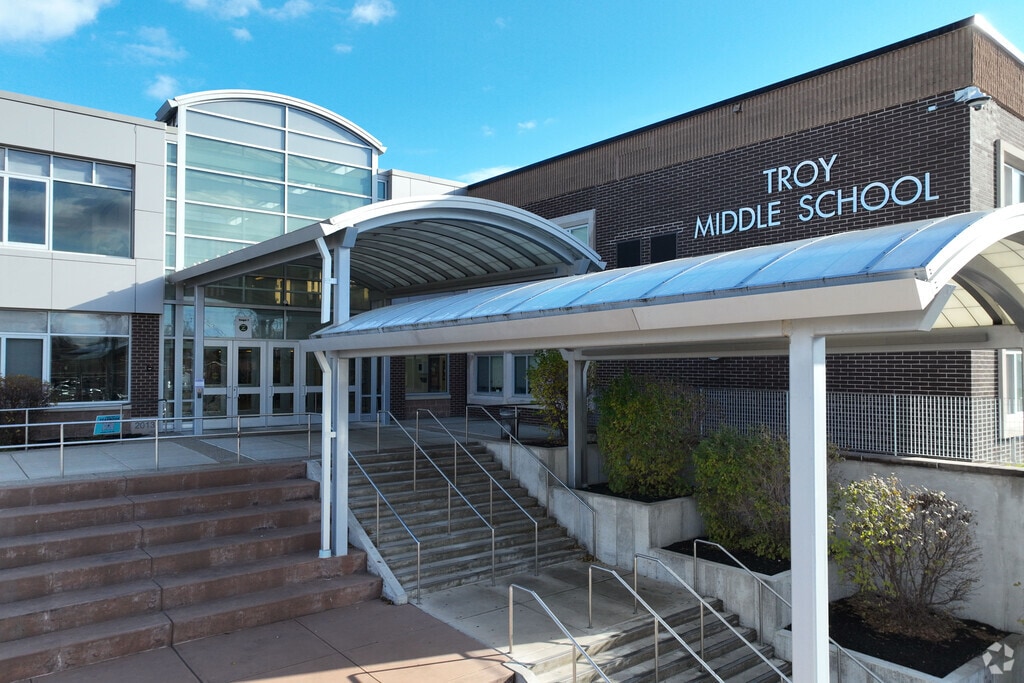 The main entrance of Troy Middle School serving grades 6-8 and with a B- on Niche.