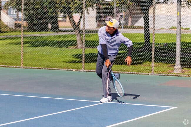 Tennis game in the park at Bixby Knolls