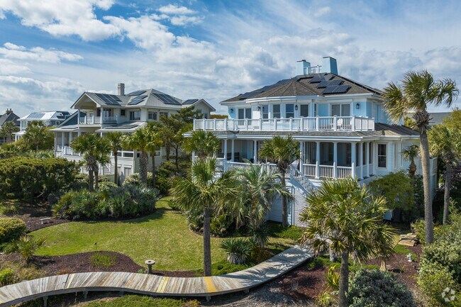Isle of Palms has spacious waterfront homes with lovely landscaped lawns.