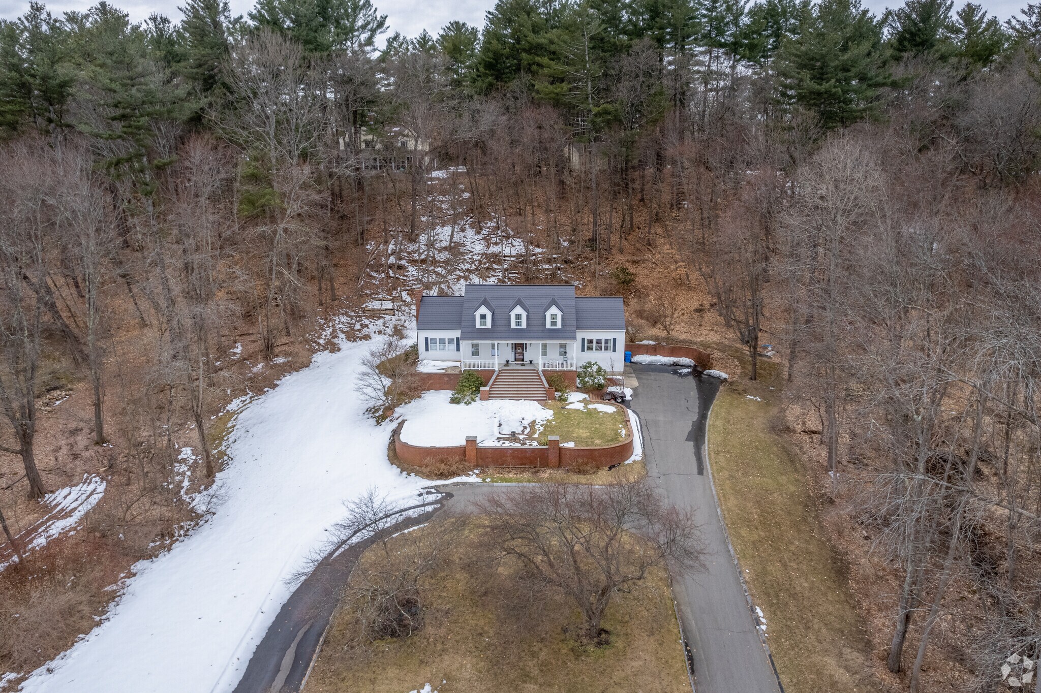 An expanded cape home set beautifully on a spacious lot in Merrimac, MA.