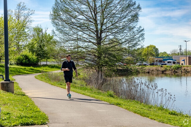 Active Southeastern Hills residents walk around the lake using interwoven bridges.