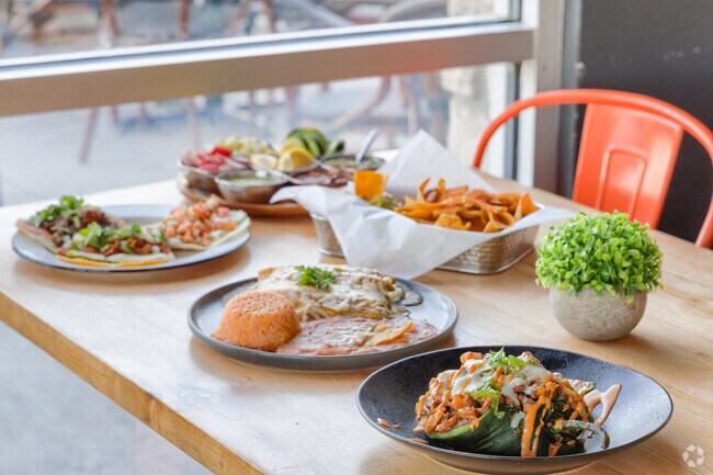 Savor gourmet tacos, irresistible grill classics, and ice-cold brews at D'Poly Taco, Grill & Beer on Main Street in El Centro.