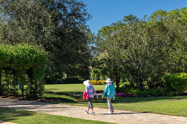 Mediterra residents can stroll around the beautiful grounds on walkways throughout the property.