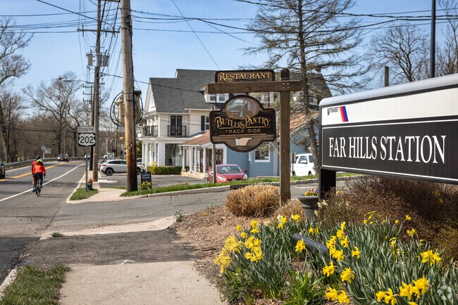 Cyclists whizz past the NJ Transit Far Hills Station, which also has a trackside restaurant.