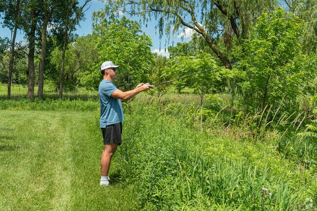 A fisherman awaits his first bite of the day at the Hobson West Ponds in Naperville, IL.