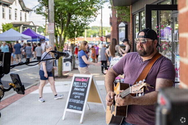 Residents enjoy live music as they walk from vendor to vendor at the Greensburg Night Market.