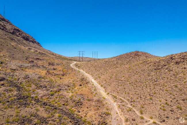 At the edge of Henderson sits Sloan Canyon, offering many trails for hikers.