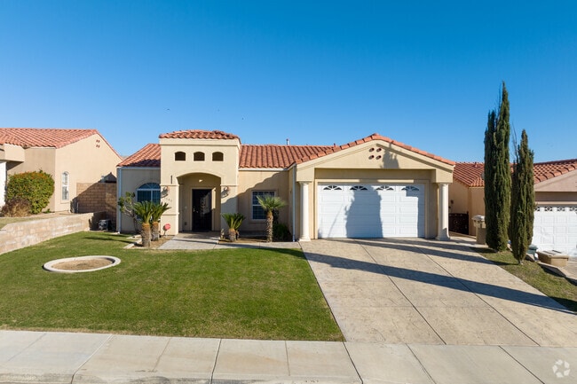 This house in the newer part of Edison takes cues from French Revival style with white pillars.