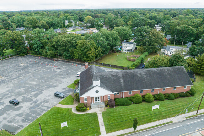 Here we see an aerial with a large adjoining parking lot.