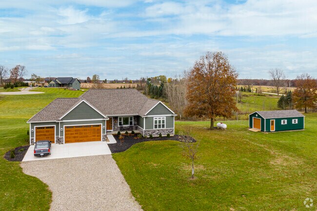 Contemporary and neo-colonial homes are often found alongside farmland in Oregon Township.