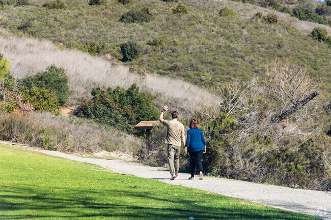 A couple walks together at Rancho Mission Canyon Park near Del Cerro.