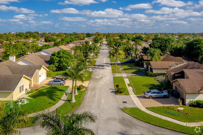 Residents can take in a beautiful view of ranch style homes in North Lauderdale, FL.