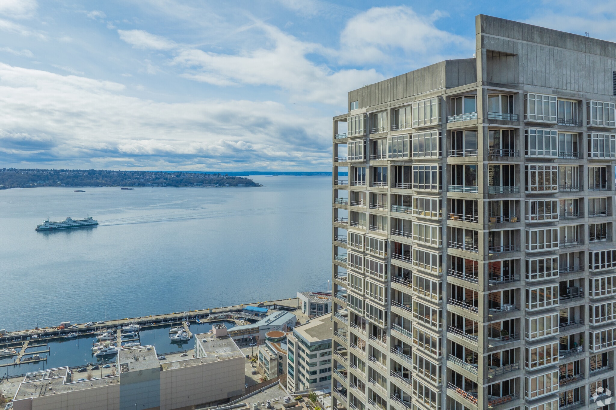 Highrise Belltown condos have perfect views of the Puget Sound and Olympic Mountains.