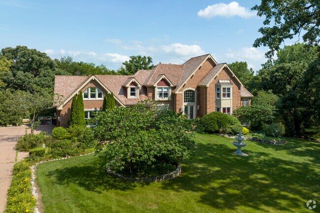 Various mansion styles can be found along Whispering Trail road in South Elgins premier locale.