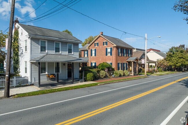 Colonial homes both in brick and wooden siding sit side-by-side in Maytown.