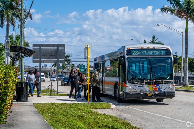 Bus Picking up passengers at the Stop In Pembroke Park.