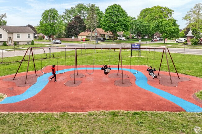 Children enjoy swings and playground equipment at Rouge Park during summer months.