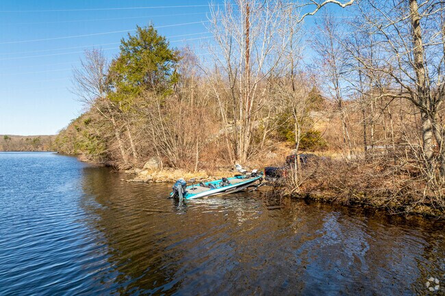 A person backs their boat into the Shetucket River for an afternoon of fishing, near Lisbon.