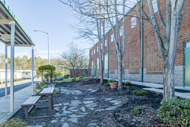 Garden and seating area at student drop off and pickup of Providence Spring Elementary School.