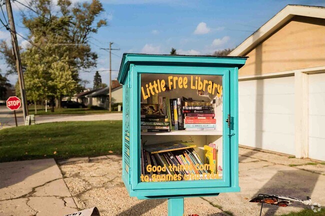 An unbelievably cute free Library sits in the front of a charming home in Thornton.