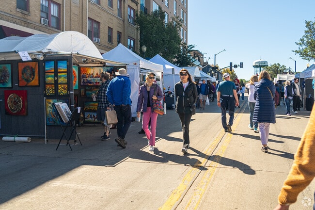 Friends enjoy art and a beautiful summer morning at the Downers Grove Fine Arts Festival.
