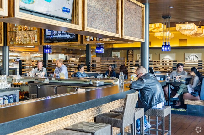 Grab a tiki bar inspired cocktail, like the Hawaiian Butterfly, at Pacific Catch's full bar.