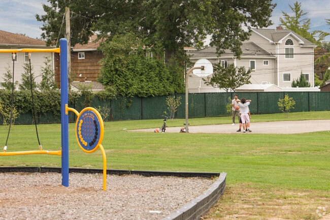 Local children love playing basketball in the Syosset Circle Park S-6 in Syosset, NY.
