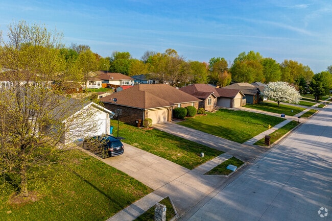 Newer constructed ranch style homes line a neighborhood street in Young-Lilley