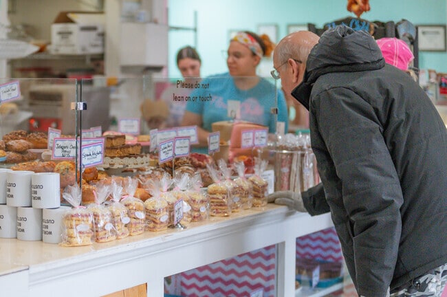 A man selects a tasty pastry at Flour Child Bakery in Grand Ledge.