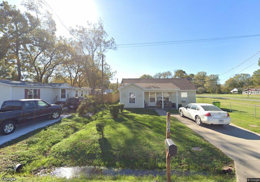 1204 E Harrison St, Stuttgart, AR 72160 - photo 1