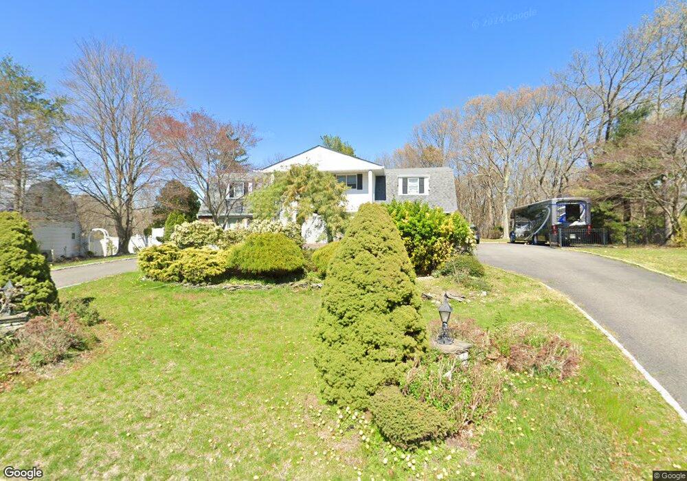 99 Wichard Blvd, ComMacK, NY 11725 - photo 1