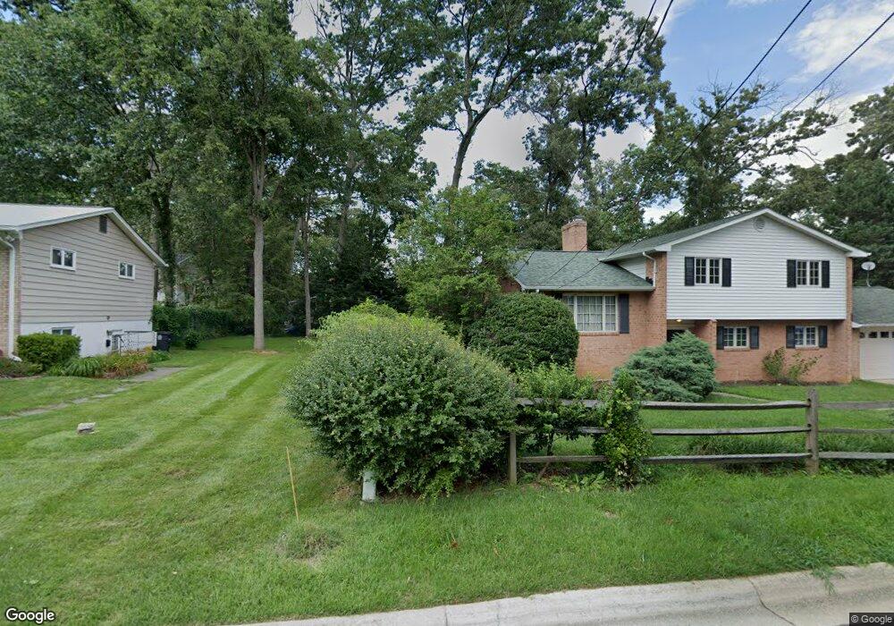 Lot is between #9906 E Franklin Ave, Glenn Dale, MD 20769 - photo 1